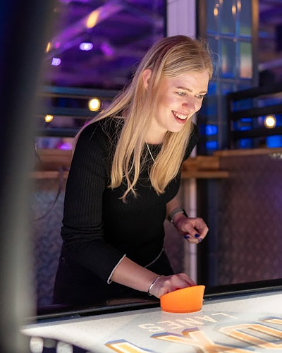 Ettie playing Air Hockey