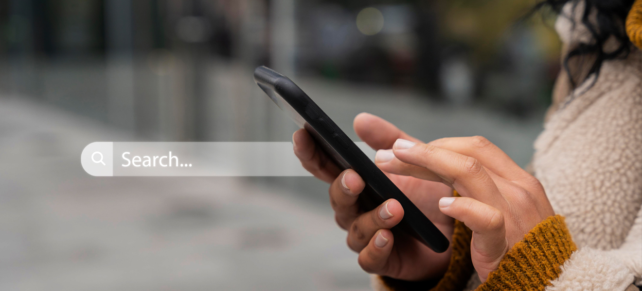 female with mobile phone in hand and a search bar overlaid onto image