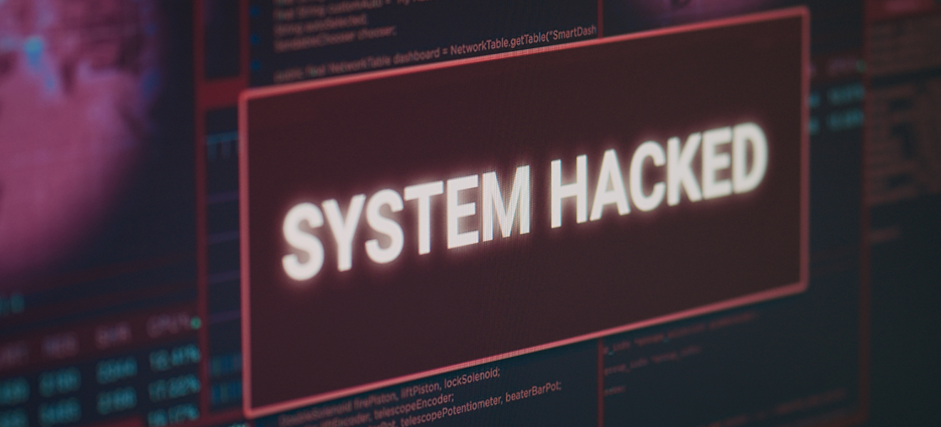 image of screen displaying the words system hacked