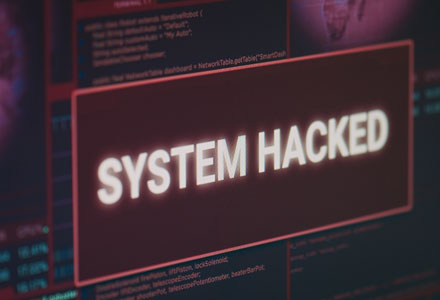 image of screen displaying the words system hacked