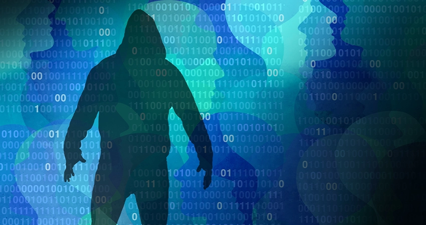 A hooded figure silhouette stands menacingly in front of a computer binary code background, a pattern of anonymous faces is also layered in the background.