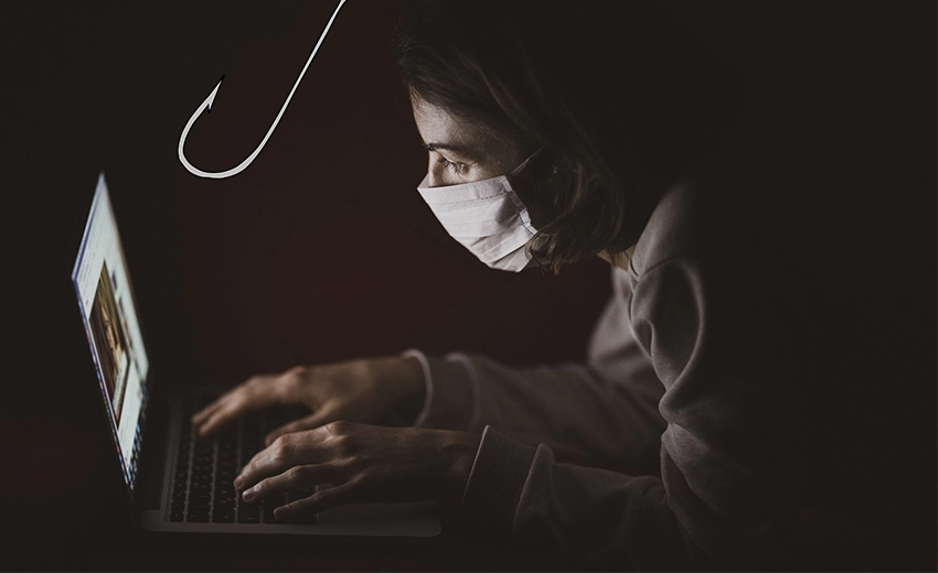 A woman hunched over a laptop typing in the dark wearing a covid mask. A sharp sinister fishing hook hovers above, in between her and the laptop.