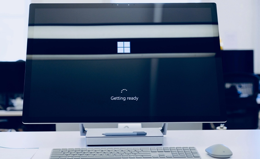 A large modern desktop computer displaying the windows logo and a whirring icon with the text ‘Getting ready’ underneath.