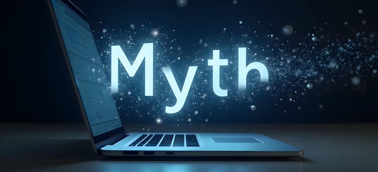 A laptop in a dark room with the word myth hovering above it.