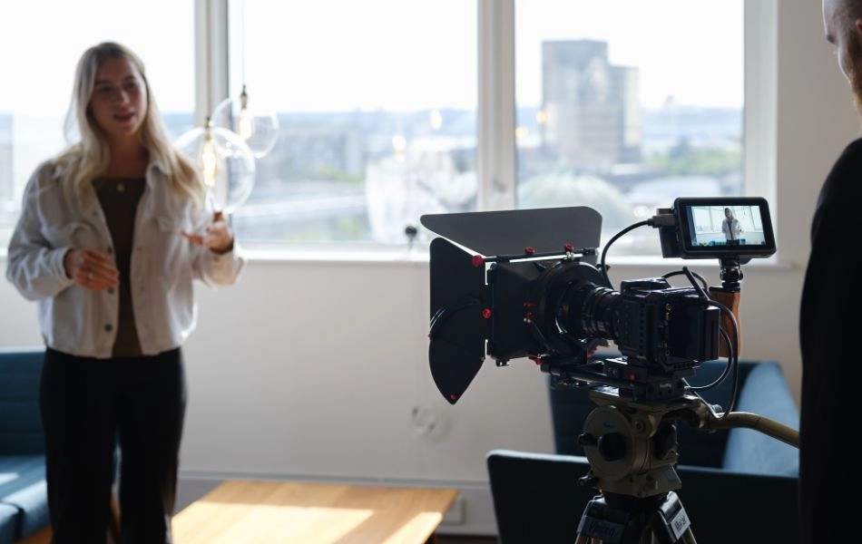 Image of team member being photographed.