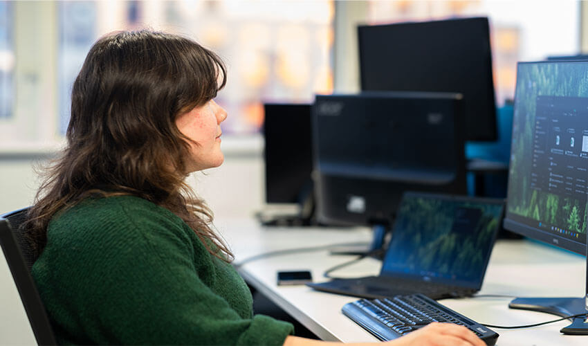 Emily working at her desk.