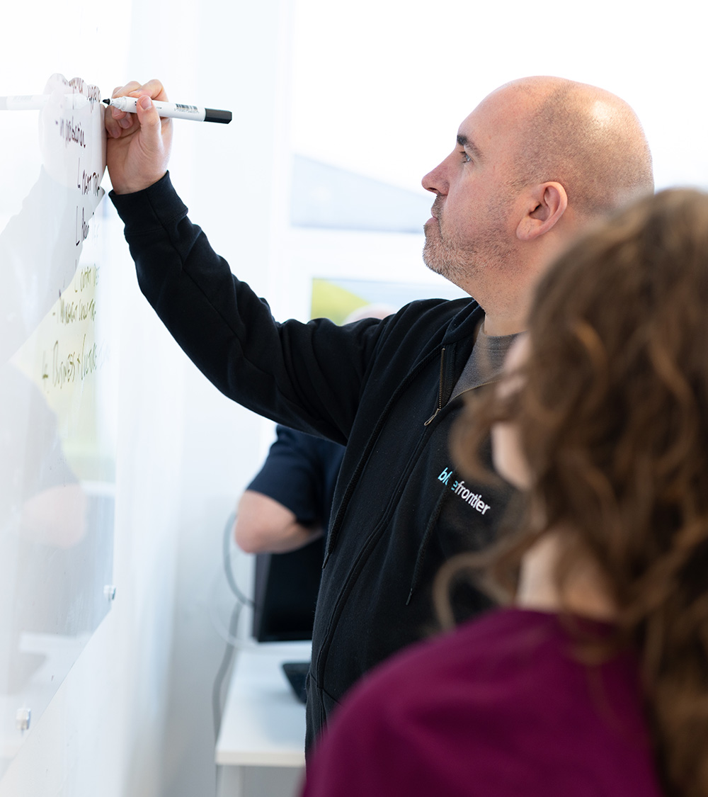 Dave and Issy Brain storming on whiteboard