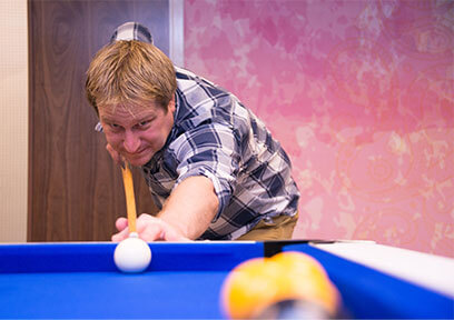 Mike playing pool.