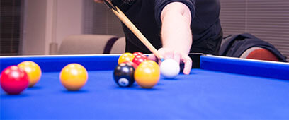 Playing pool.