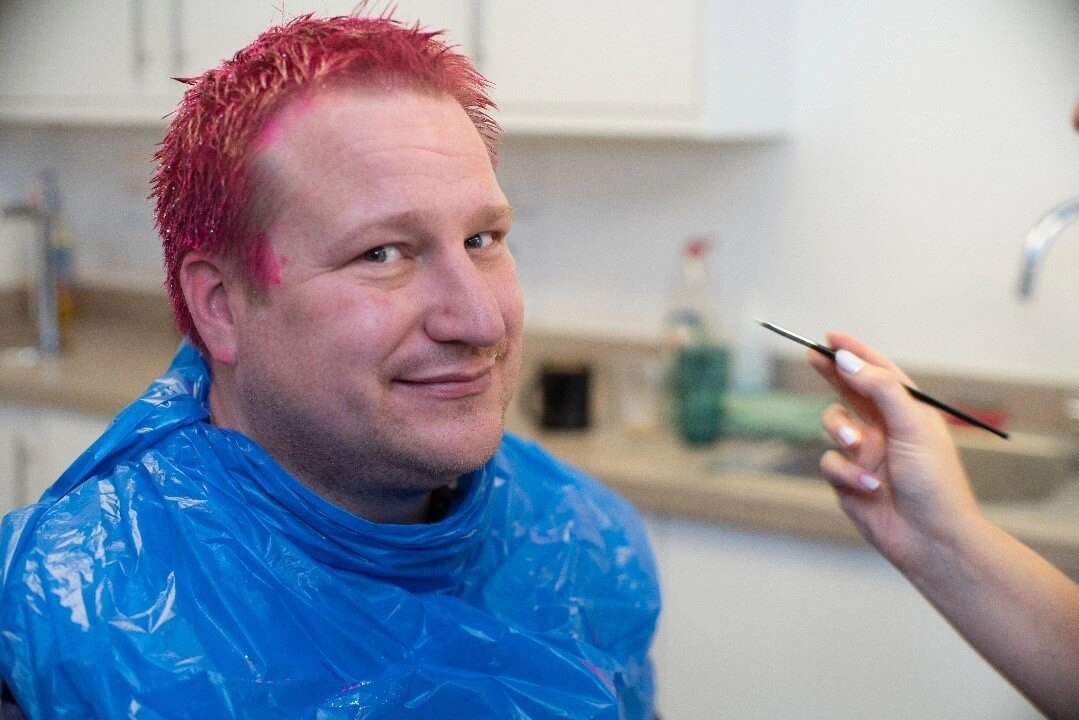 Mike with pink hair.