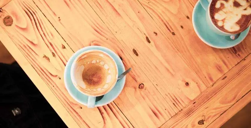 Coffee cup on a table.