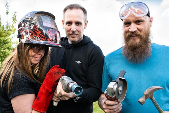 The team posing with tools.