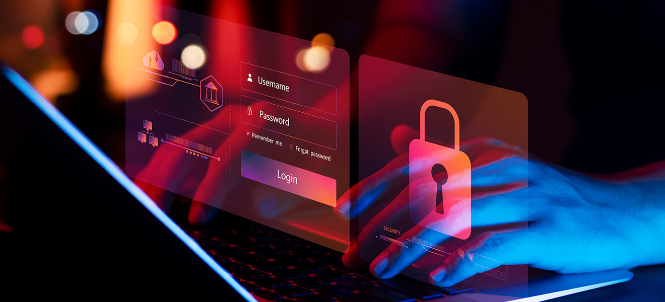 Typing on a laptop with a red overlay of a login screen and padlock icon.