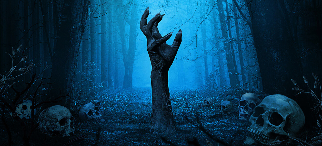 A creepy hand coming out of a dark woodland floor. Skulls surround the area.