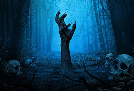 A creepy hand coming out of a dark woodland floor. Skulls surround the area.