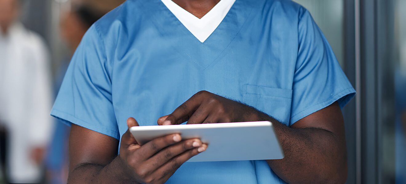 Medical staff using a tablet.