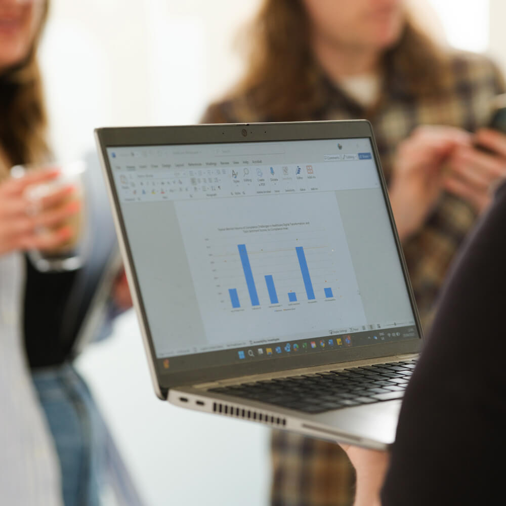 a laptop with a data graph on screen a laptop with a data graph on screen